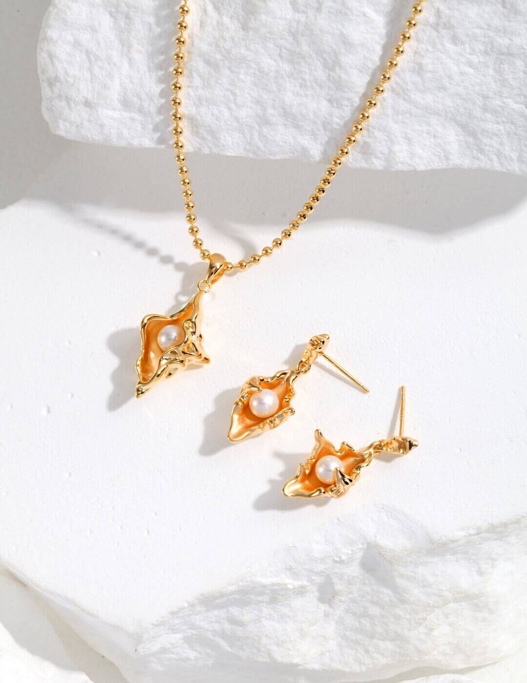 Complete Conch Shell Design jewelry set in sterling silver with pearls, embodying ocean romance and a yearning for freedom.