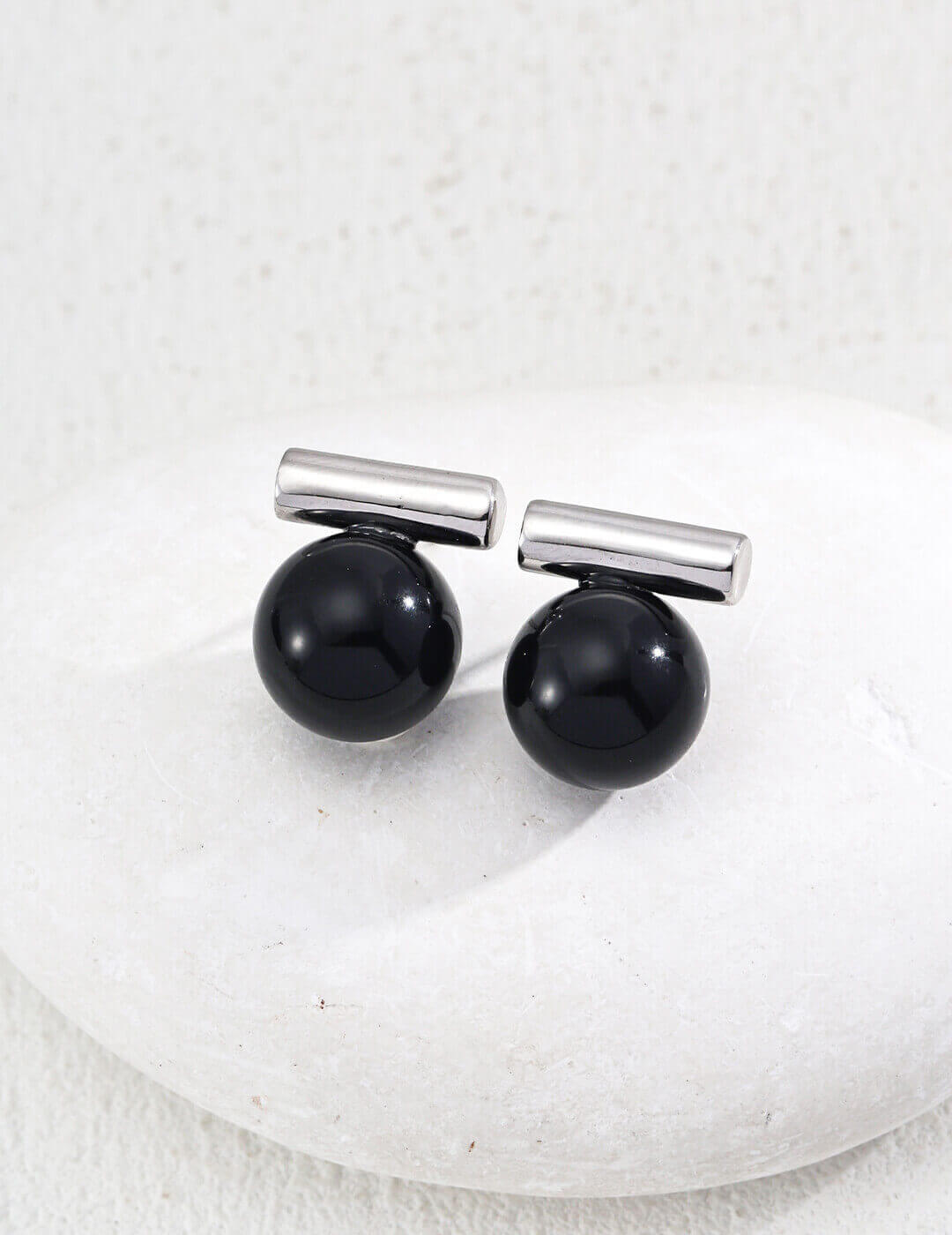 Model wearing the Silver plated version of the stud earrings.