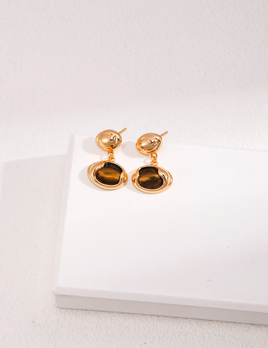15mm x 10mm Tiger Eye earrings offering perfect proportion and balance with golden-brown bands.