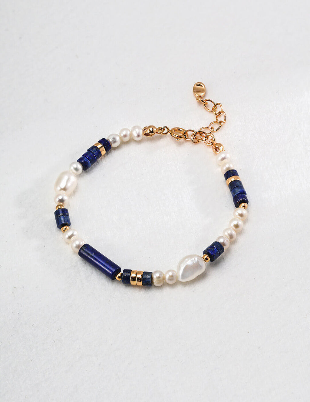 Close-up of the vintage gold clasp and 3cm extender chain on the bracelet.