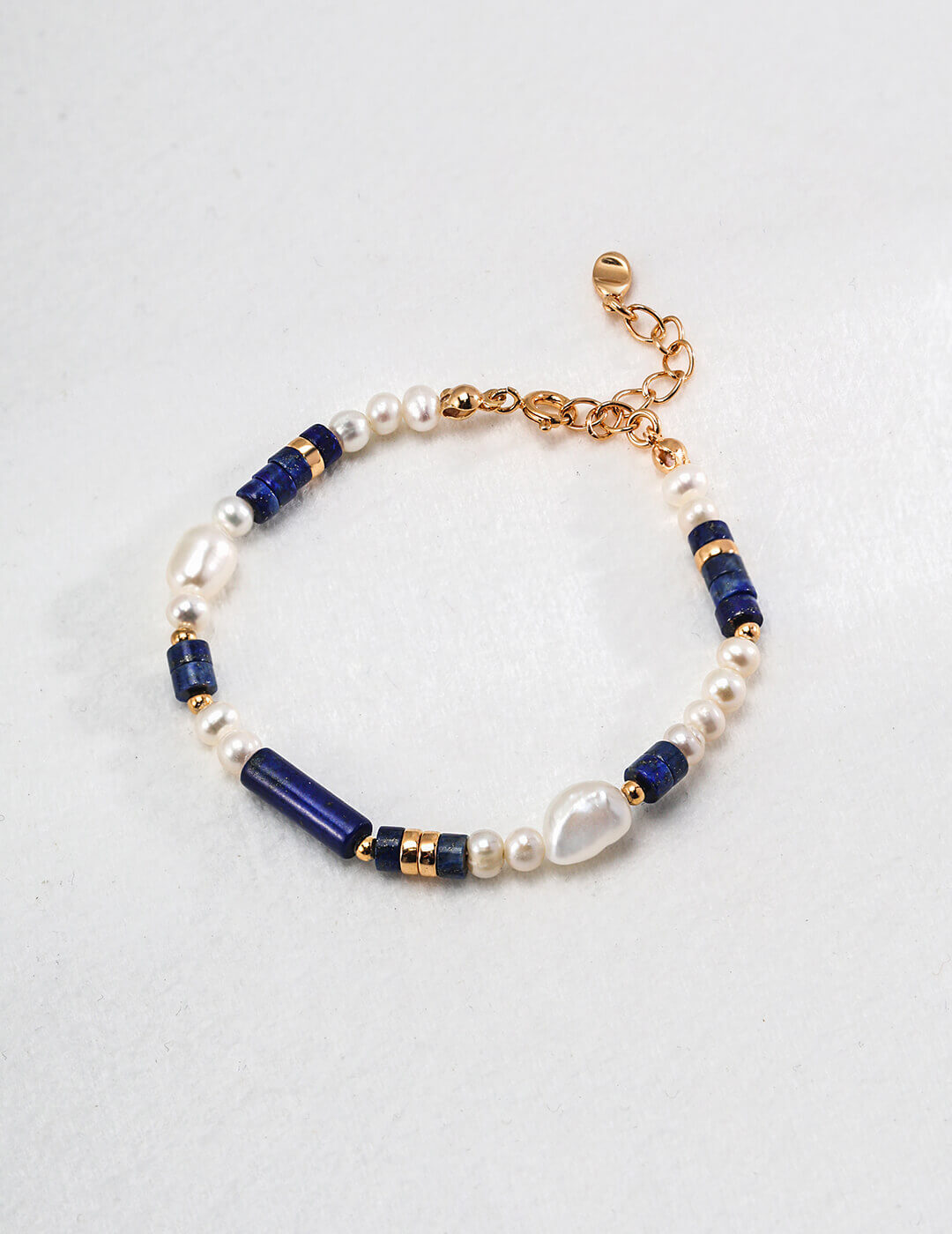Close-up of the vintage gold clasp and 3cm extender chain on the bracelet.