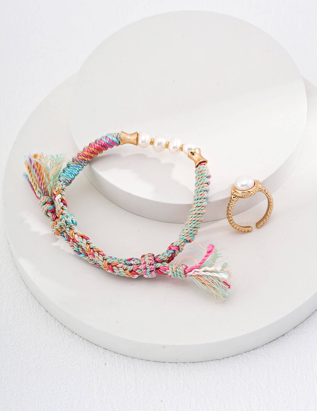 The bracelet artistically draped over a natural wood surface.
