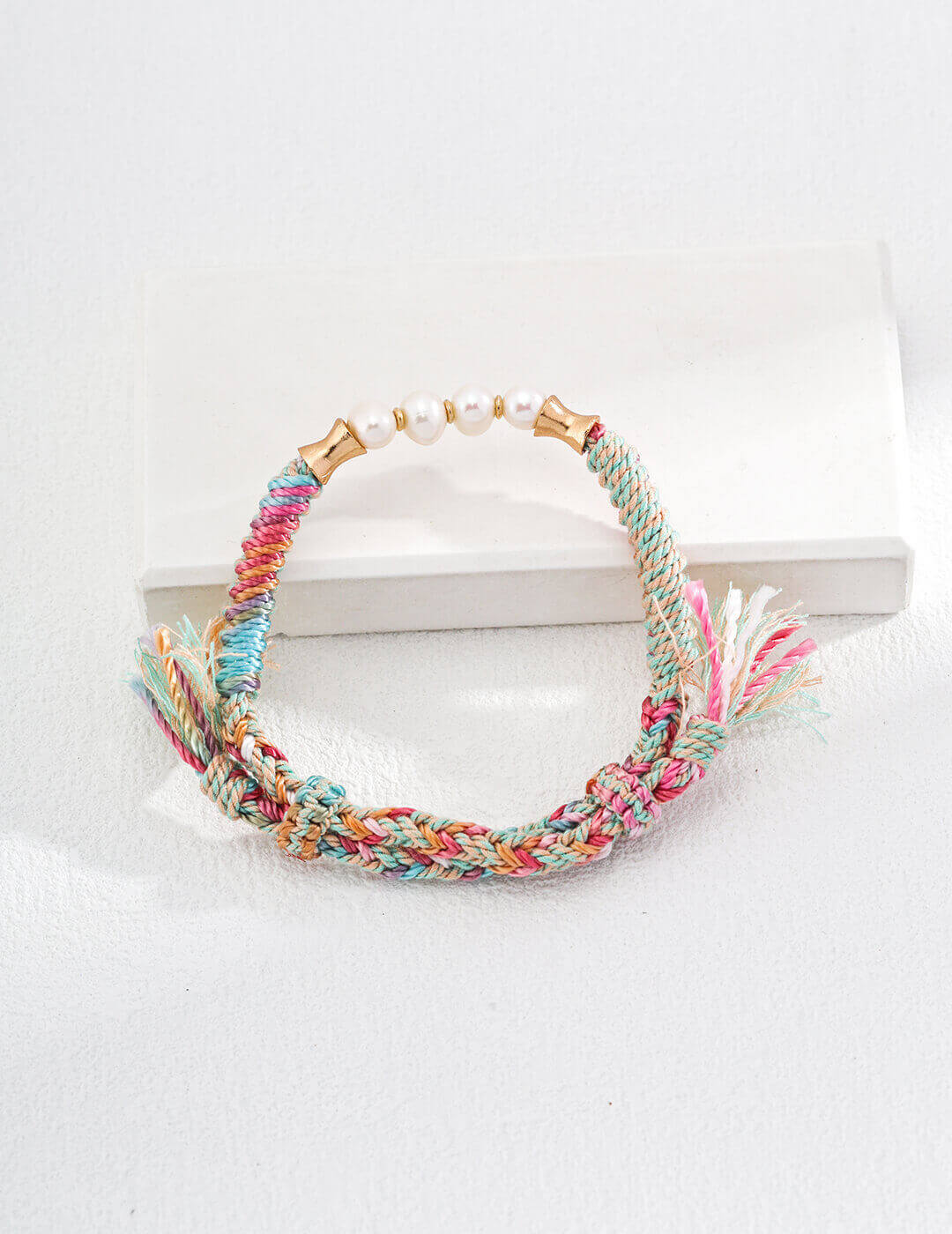 Close-up detail of the adjustable sliding knot on the bracelet.