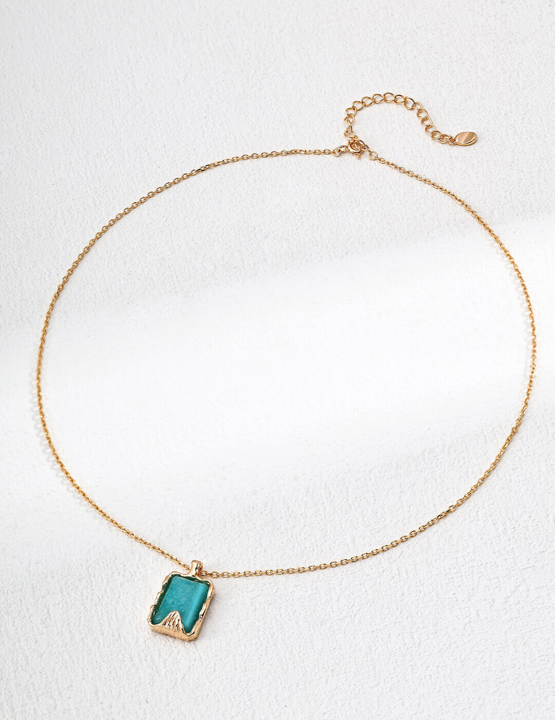 Close-up of 2x1.3cm amazonite pendant showing blue-green crystal details