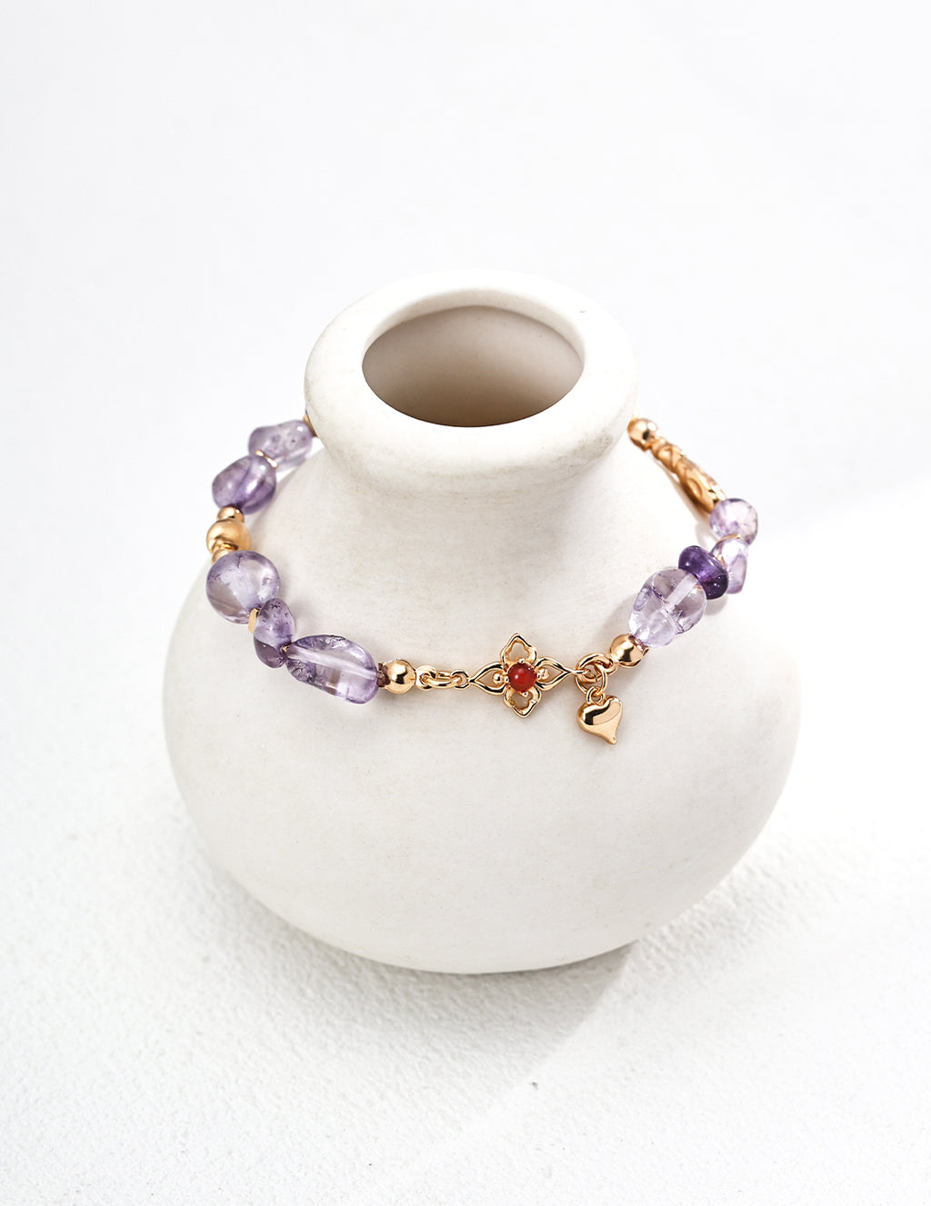 Close-up shot of the 3mm red agate and amethyst beads, showing their color contrast.