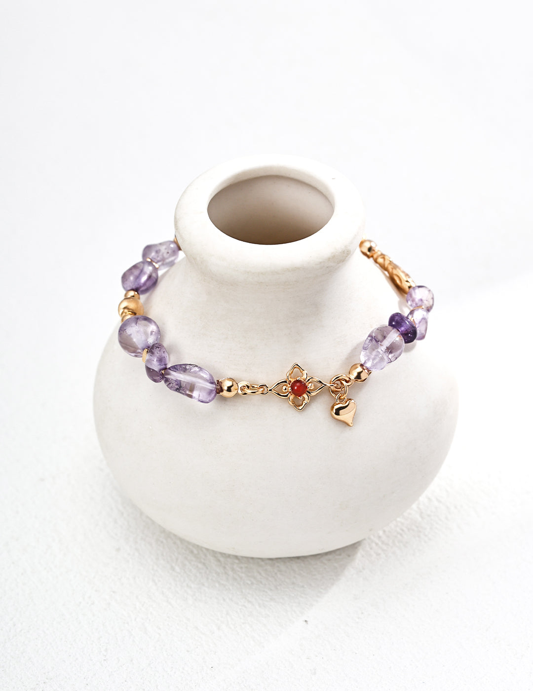 Close-up shot of the 3mm red agate and amethyst beads, showing their color contrast.