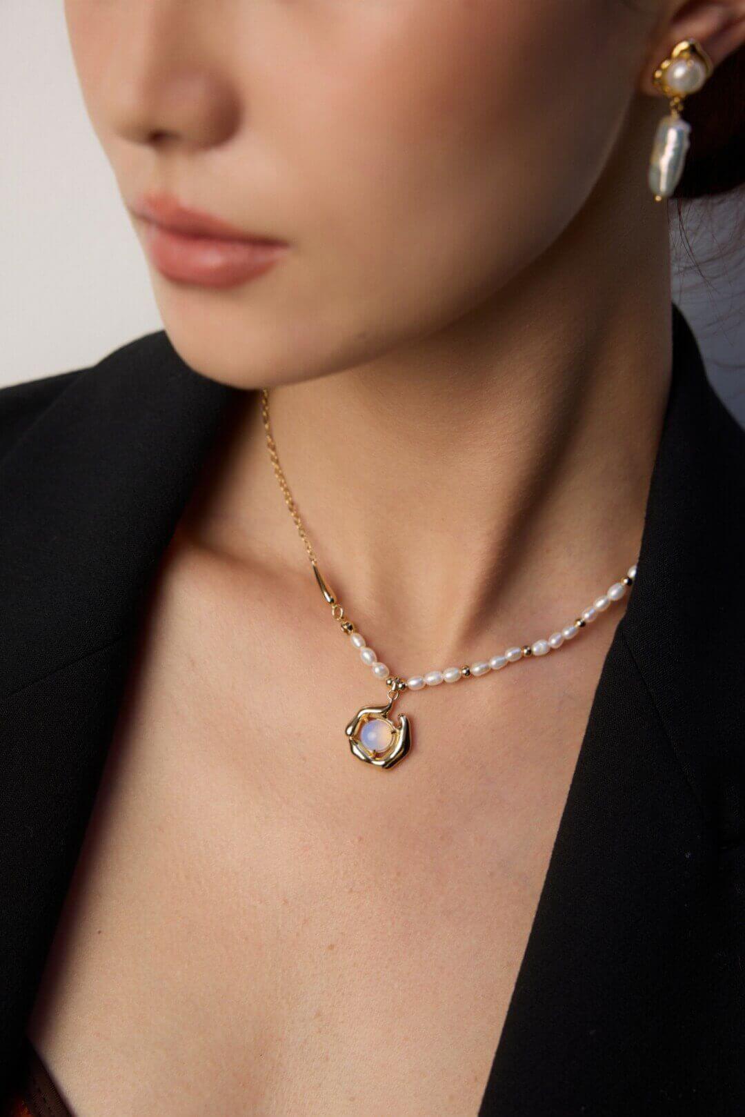 Artistic opal and pearl necklace adding a touch of nature-inspired elegance to casual everyday wear.