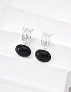 Side view of Black Onyx earrings on model, showcasing sophisticated black gemstones against skin tone.