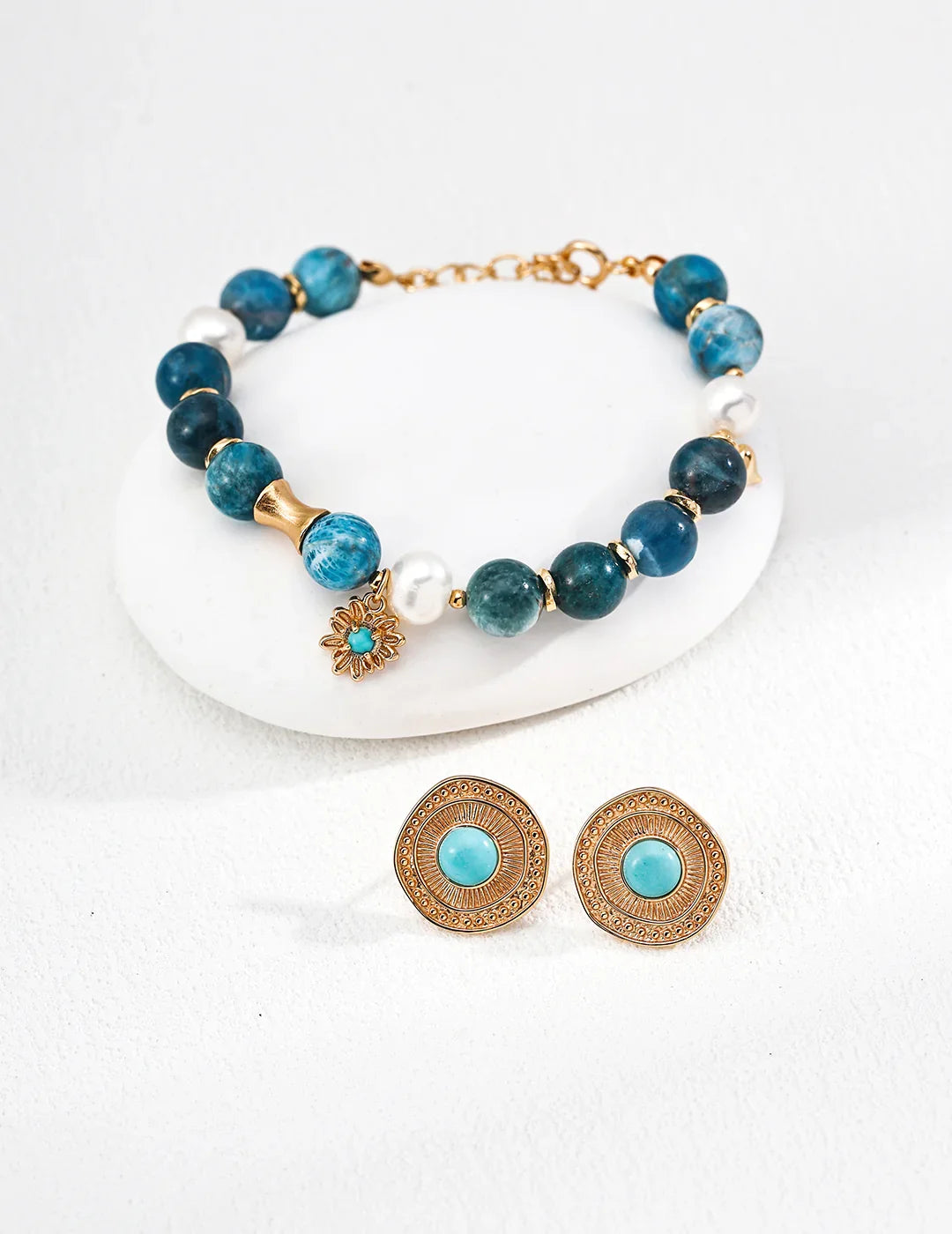 The Blue Harmony azurite bracelet stacked with other delicate bracelets, illustrating a bohemian and layered jewelry style
