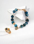 Detailed close-up of Blue Harmony bracelet, showcasing the vibrant blue turquoise and smooth pearl dangling from sterling silver.