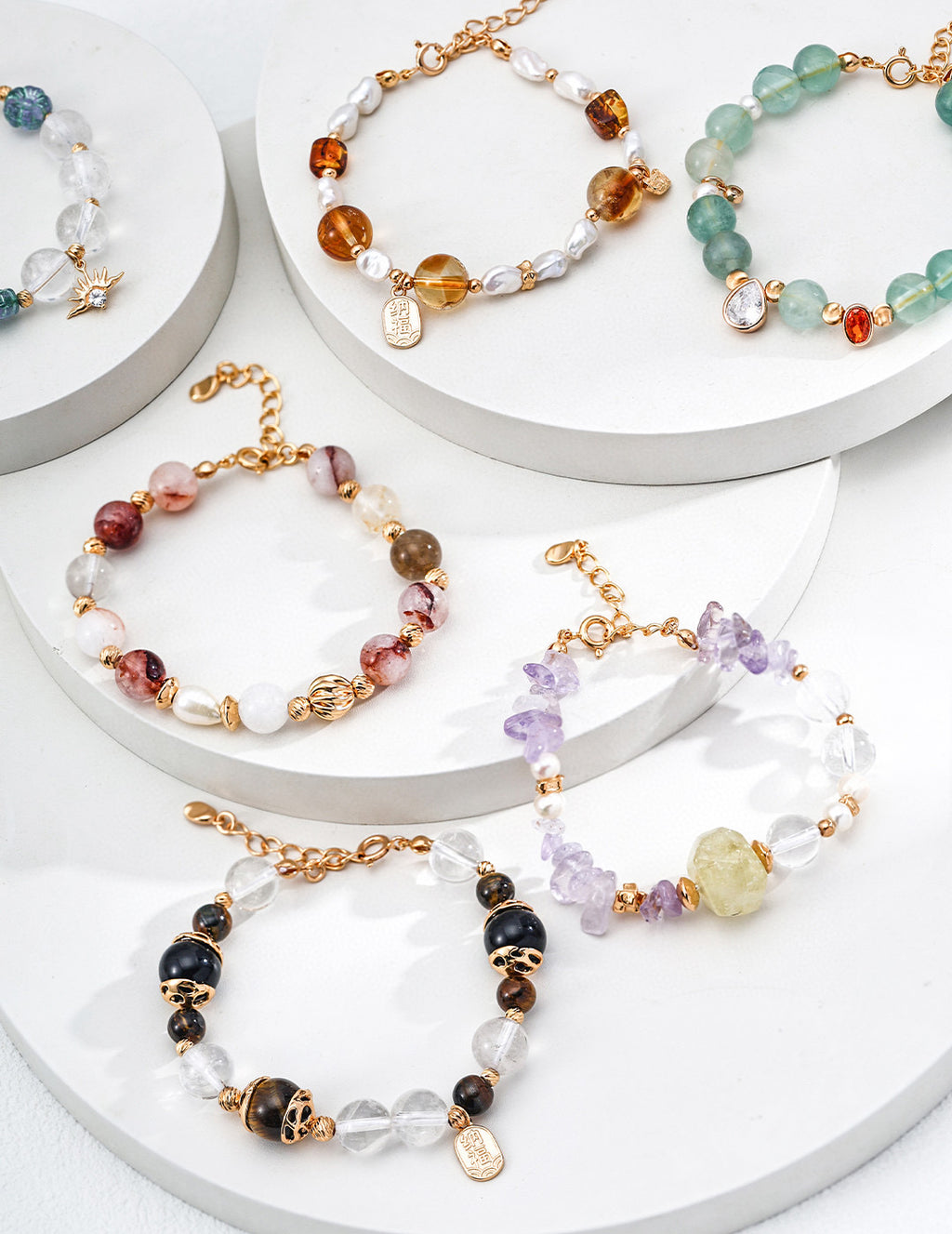 Macro photography highlighting the color and texture contrast between the red agate, pearl, and crystal beads.