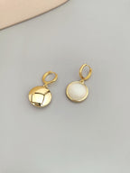 Back view showing secure closure of cat's eye stone drop earrings.