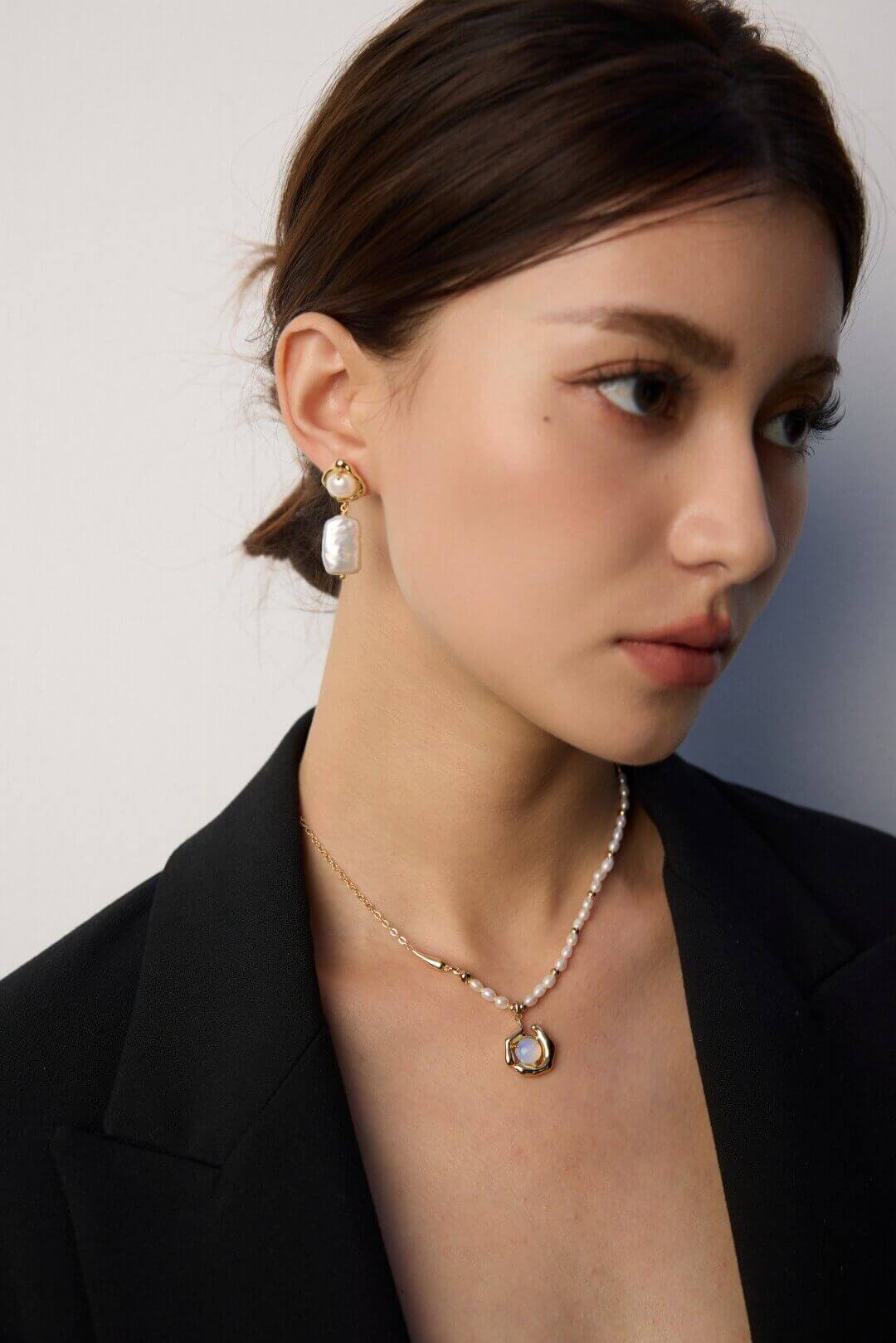 Front view of the clear lake opal pendant on model, highlighting its transparent beauty and organic silver setting.