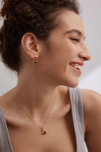 Model wearing complete Tiger Eye set creating harmonious look that transitions from day to night.