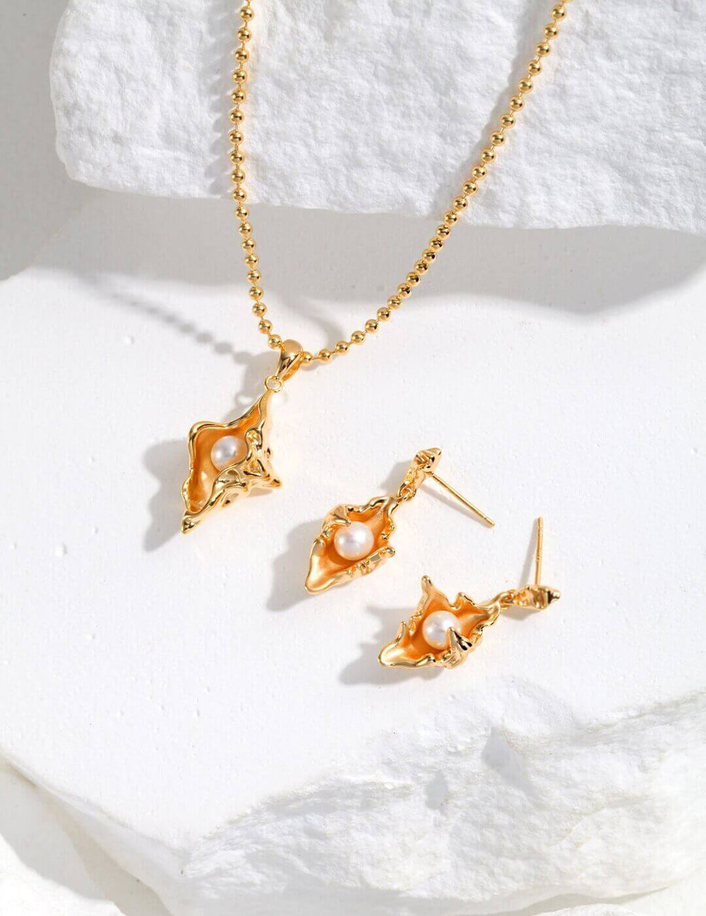 Complete Conch Shell Design jewelry set in sterling silver with pearls, embodying ocean romance and a yearning for freedom.