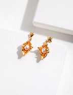 Matching conch shell pearl earrings in sterling silver, capturing diverse forms of human romance.