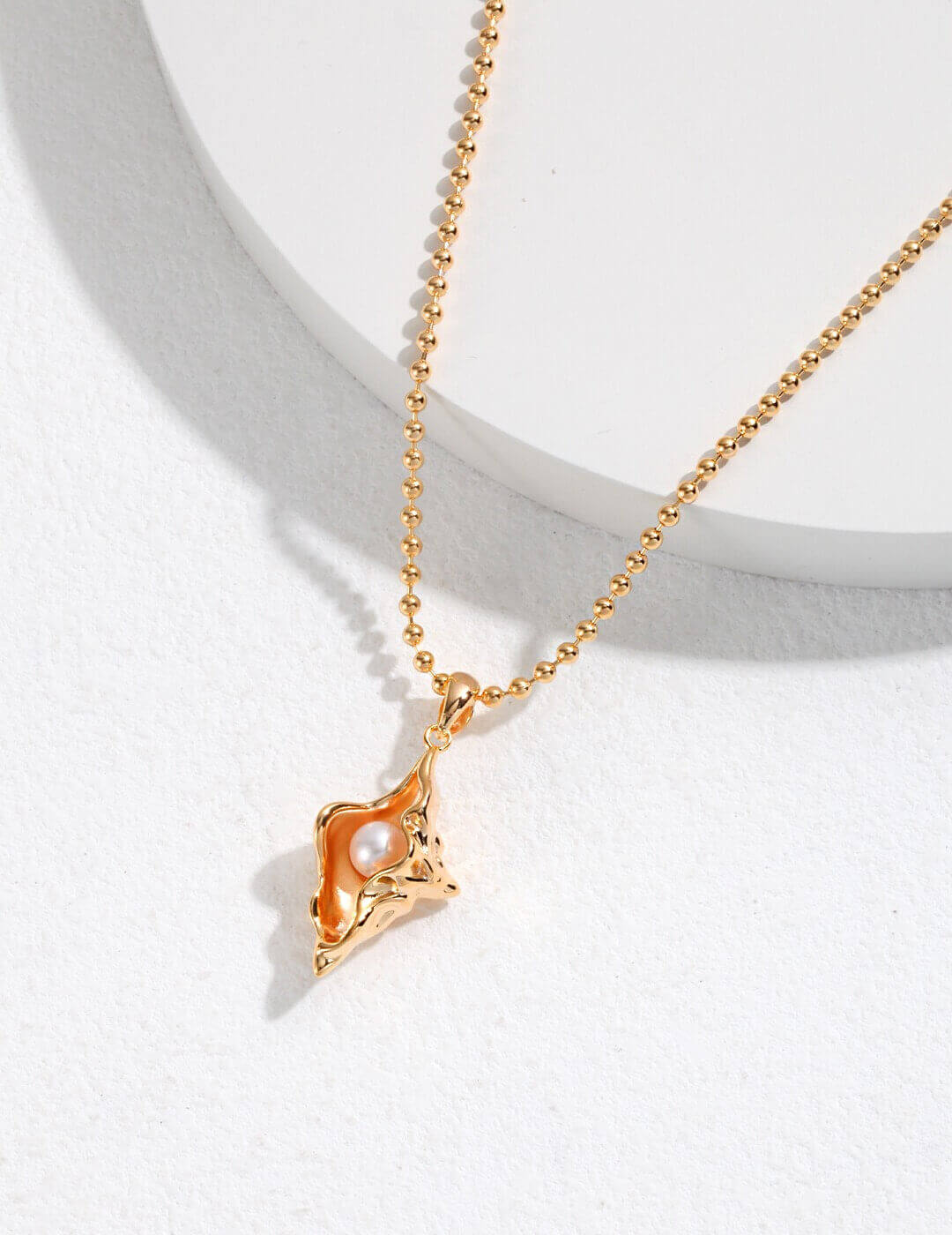 Conch shell pearl pendant necklace with 3D liquid metal design, carrying the longing of a whispered ocean song.