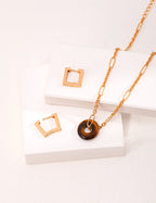 Flat lay showing the three different ways to wear this convertible jewelry set.