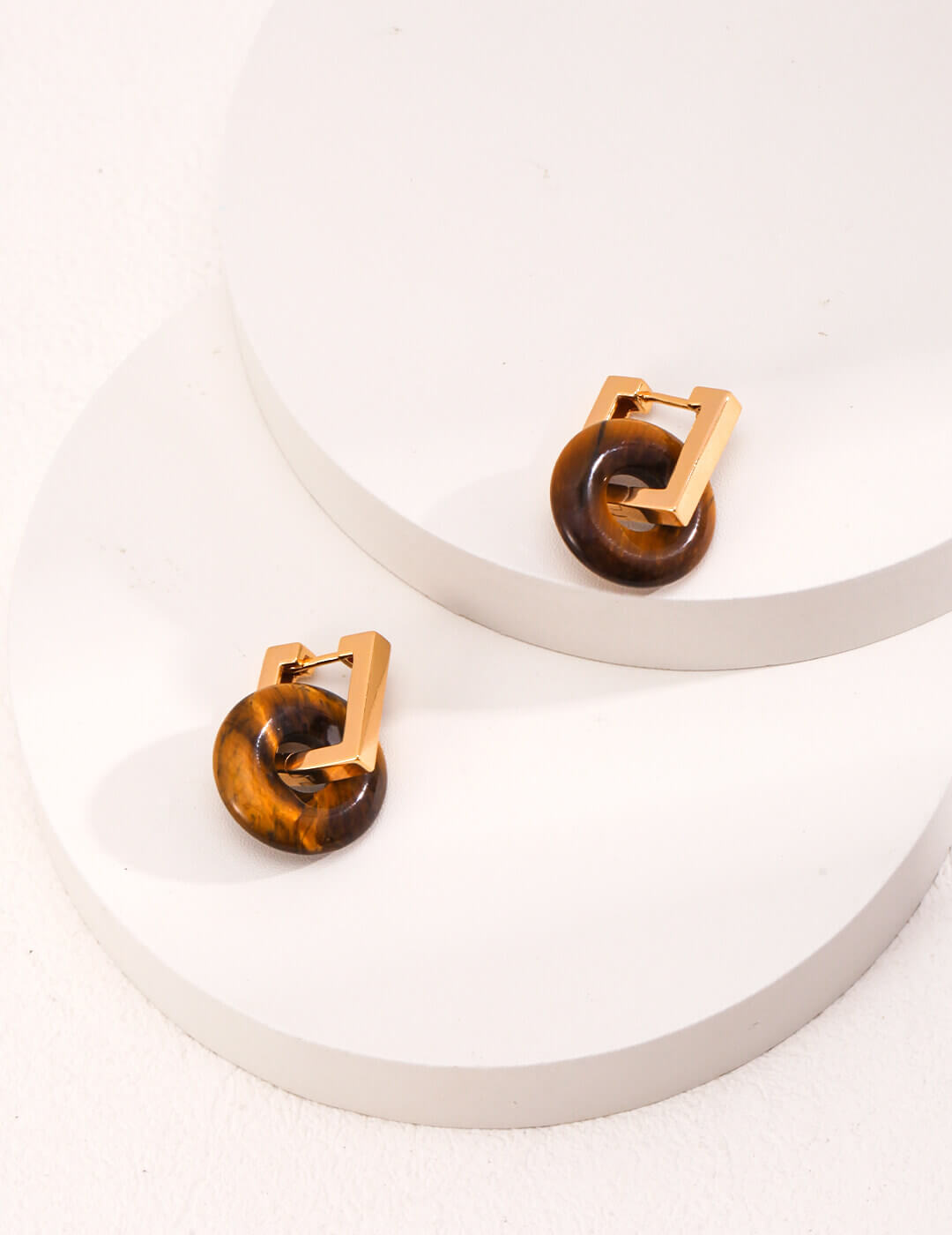 The 1.5cm Tiger's Eye stone detached and worn as a necklace pendant.