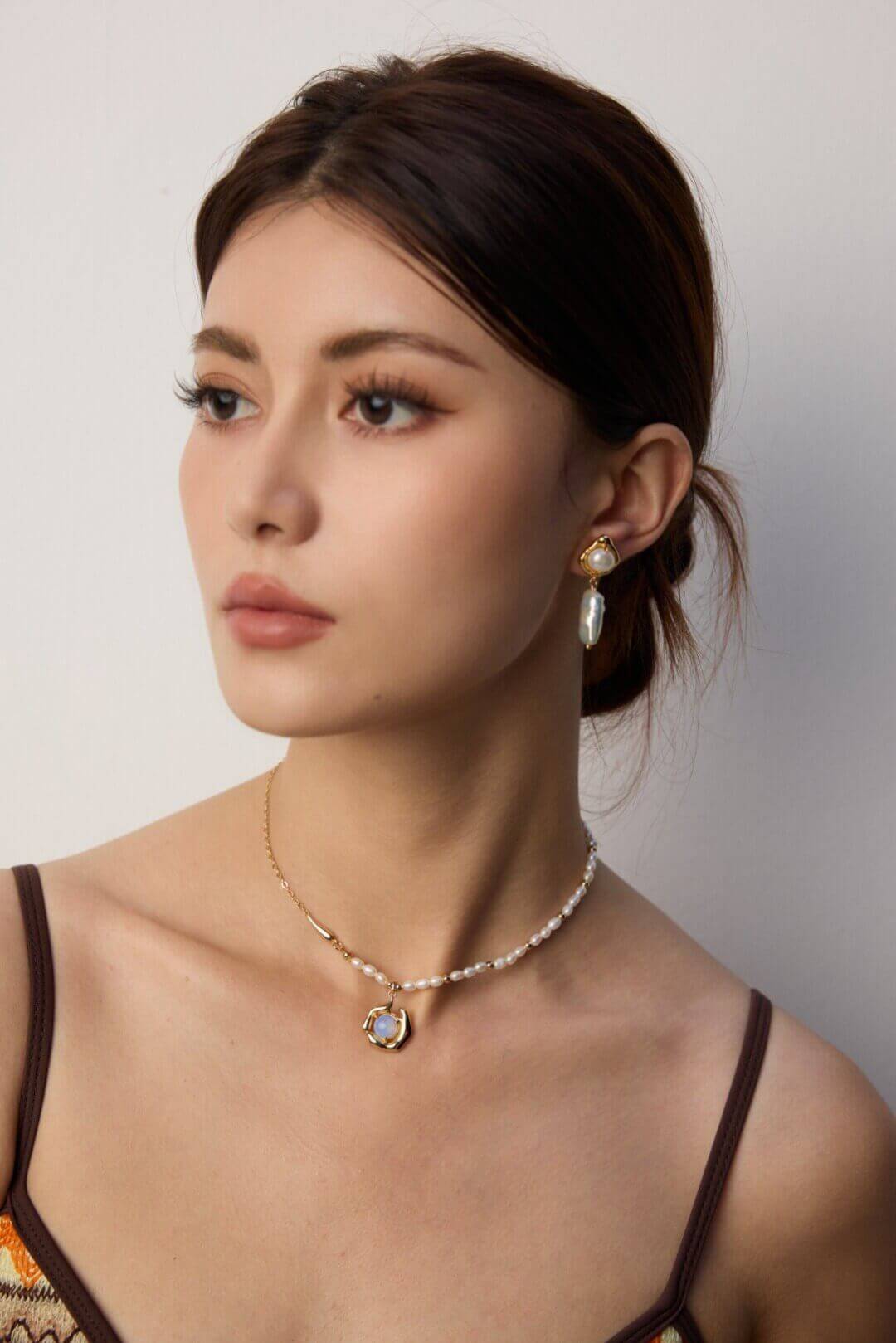 Ethereal blue opal necklace bringing a unique and sophisticated accent to professional work attire.