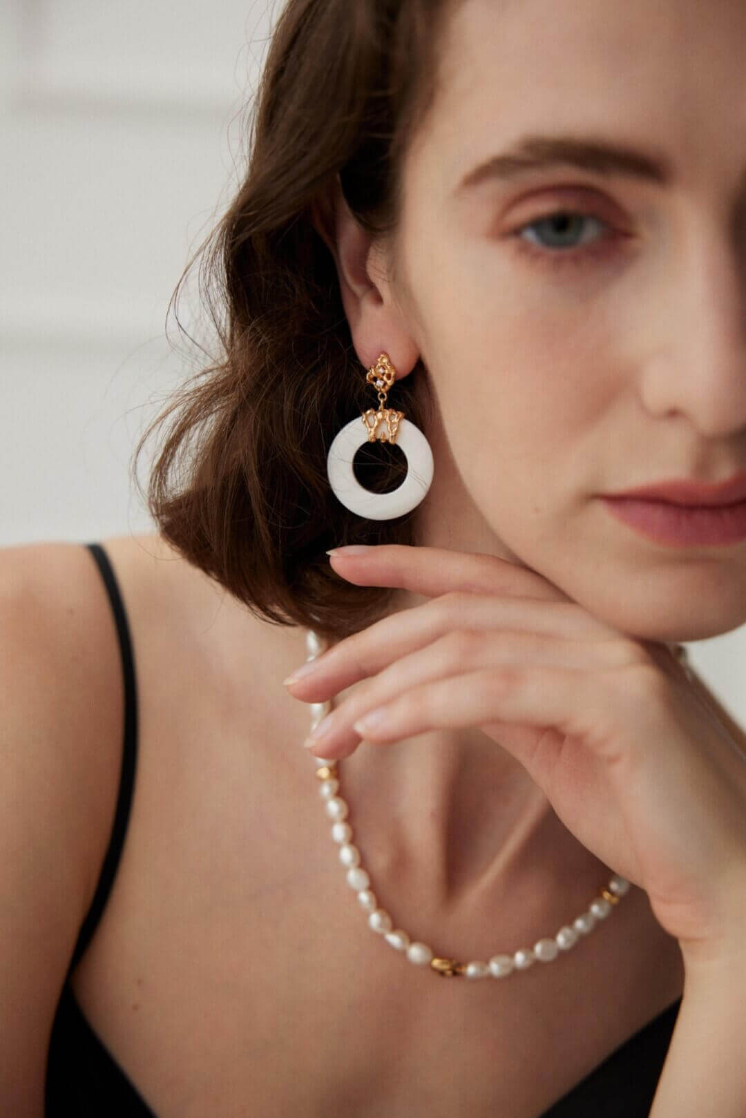 Vintage white shell earrings with hollow-out design, perfect for adding a touch of delicate elegance to everyday casual wear.