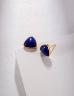 Close-up of genuine Lapis Lazuli stone with rich blue color and delicate golden pyrite specks, set in elegant sterling silver.