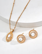 Close-up of 5mm shell cabochon showing unique iridescent glow and delicate play of color in vintage gold setting.