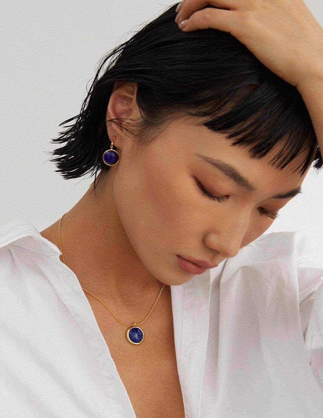 Side view of natural Lapis Lazuli earrings on model, showcasing 26mm drop and celestial elegance.