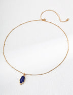 Model in natural sunlight showing the stone's true blue color.
