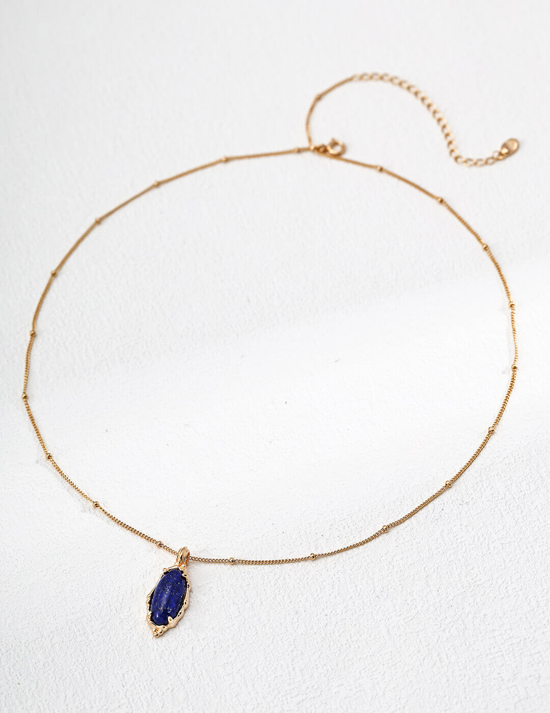 Model in natural sunlight showing the stone's true blue color.