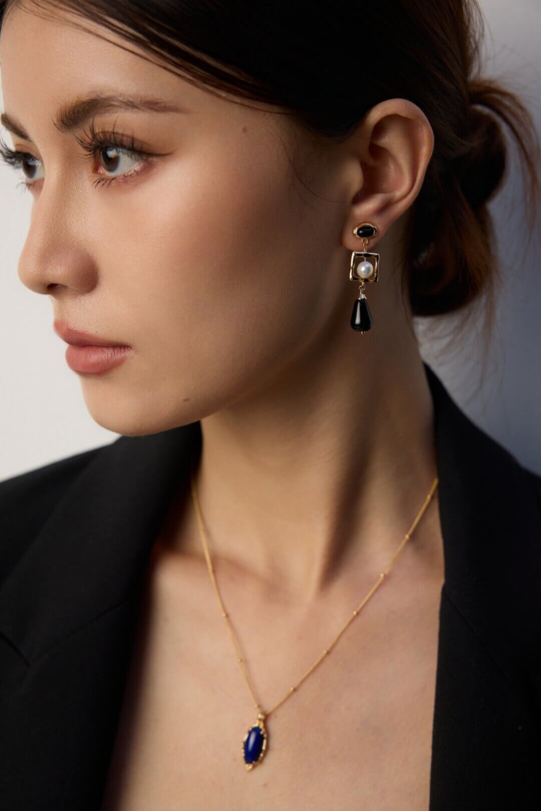 Professional woman wearing the necklace in business casual setting.