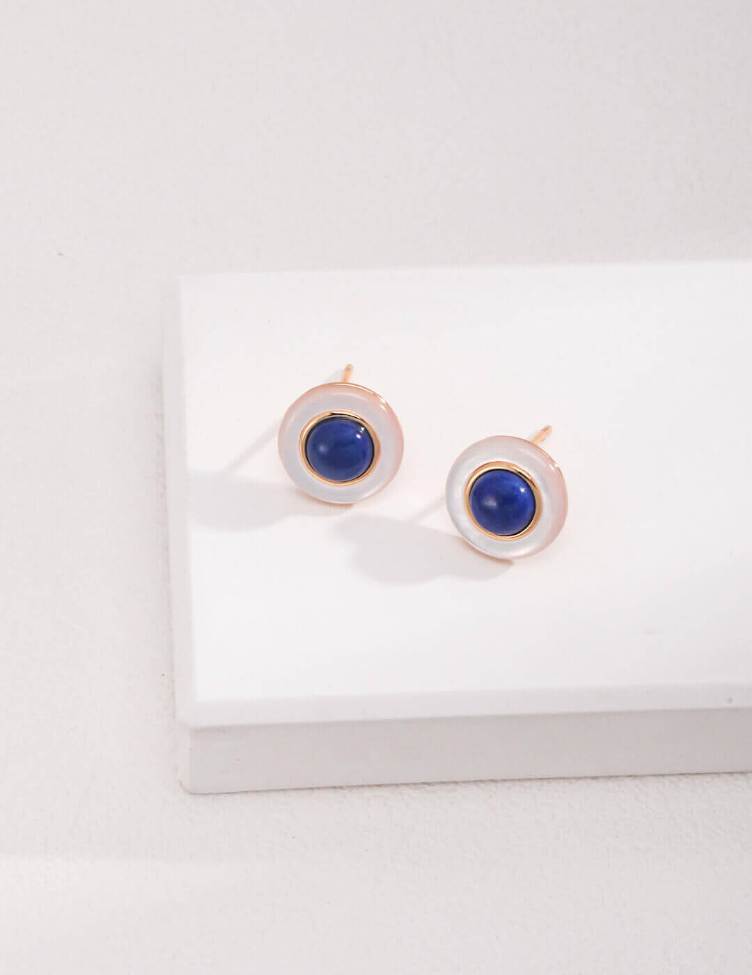 Lapis lazuli shell stud earrings in S925 sterling silver, featuring celestial depth and oceanic iridescence in elegant combination.