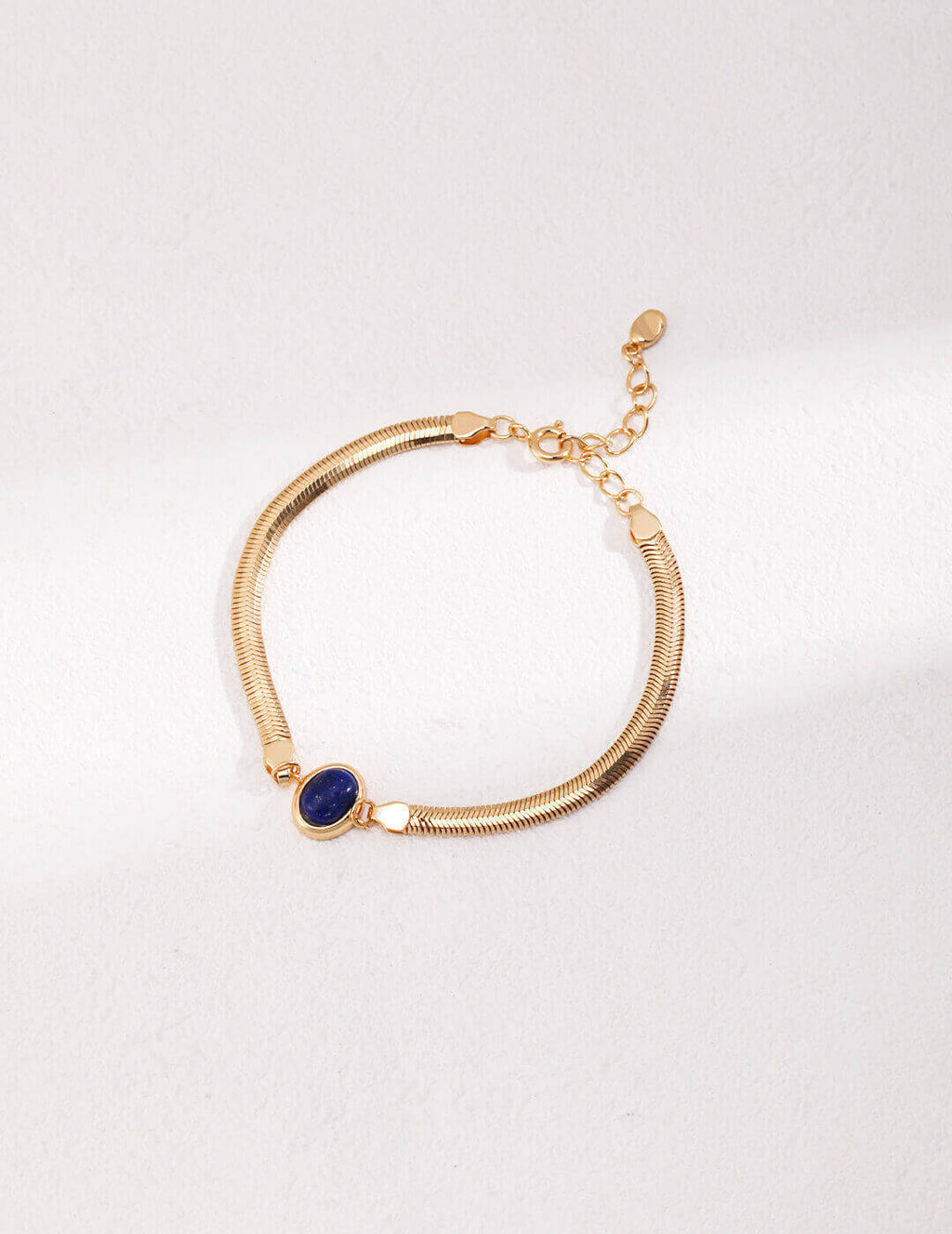 Vintage gold lobster clasp and extender chain detail on the bracelet.