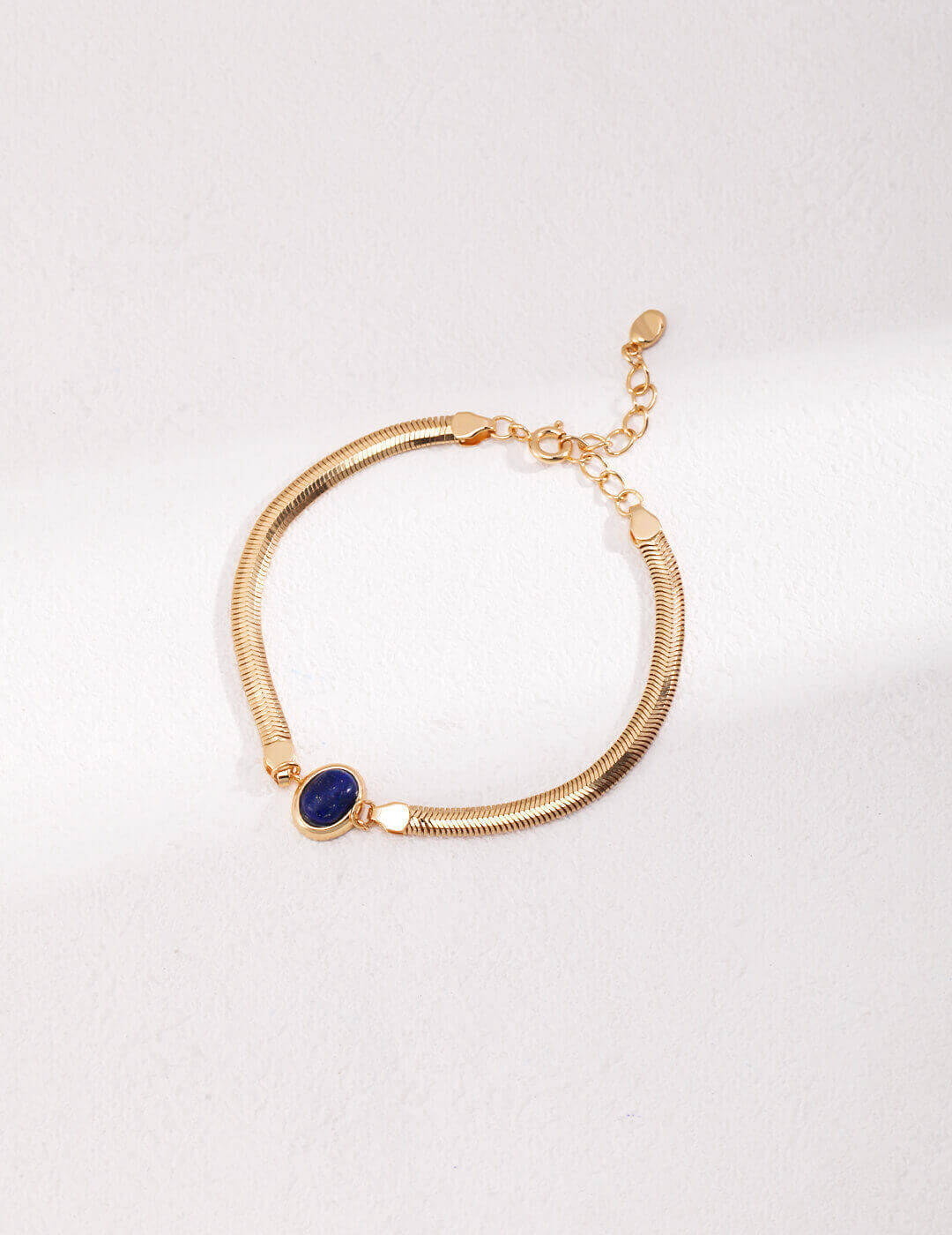 Vintage gold lobster clasp and extender chain detail on the bracelet.