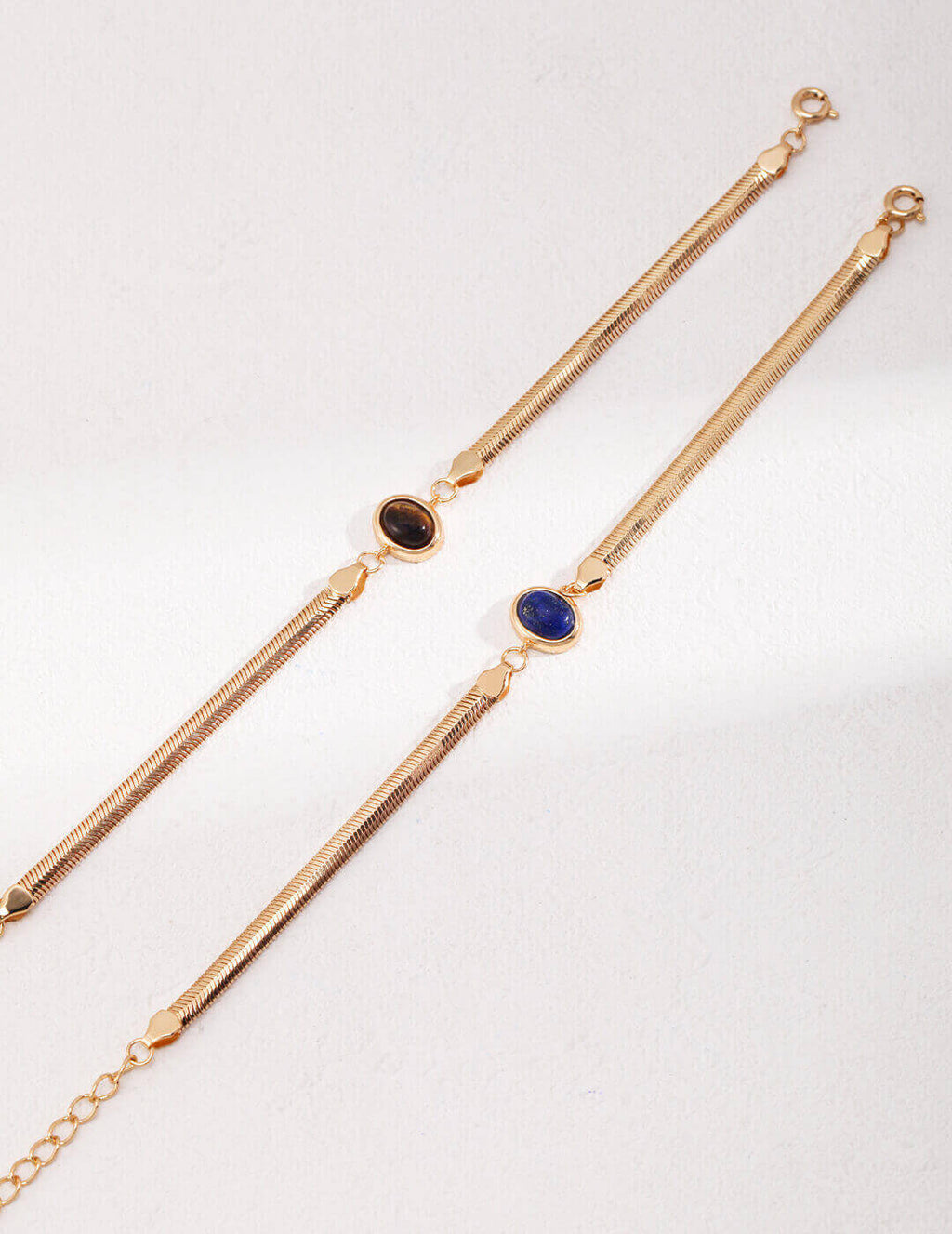 Lapis Lazuli and Tiger's Eye bead bracelet flat lay display on neutral background.