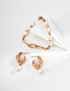 Styling the minimalist Lava Bracelet stacked with a earrings for a layered look.