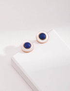 Luminous white shell reflecting subtle play of colors, capturing the beauty of the sea in earrings.