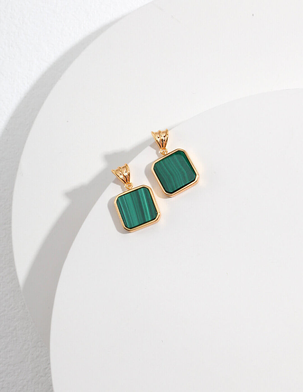 Malachite and S925 sterling silver earrings, where the pristine setting and green gemstone blend in perfect harmony like the moon in a starry sky.