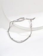 The minimalist bracelet in a warm vintage gold finish.