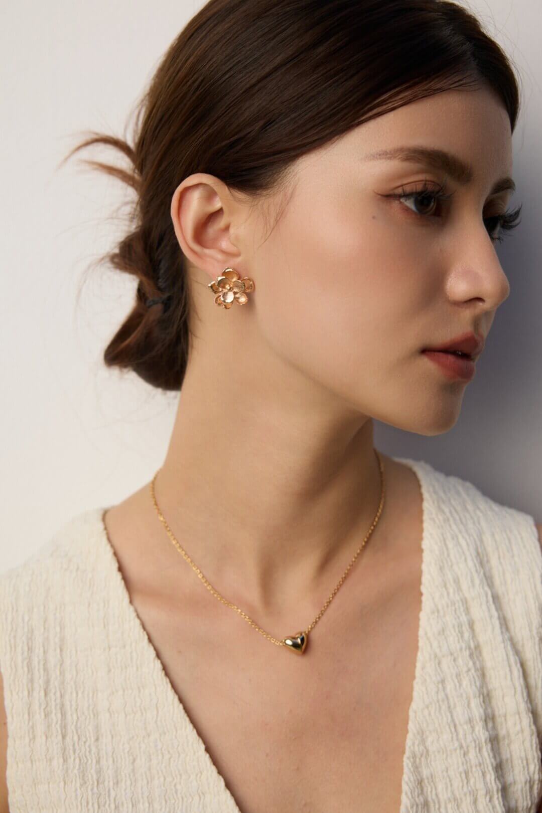 Detail shot highlighting the intricate floral pattern and vintage gold finish.