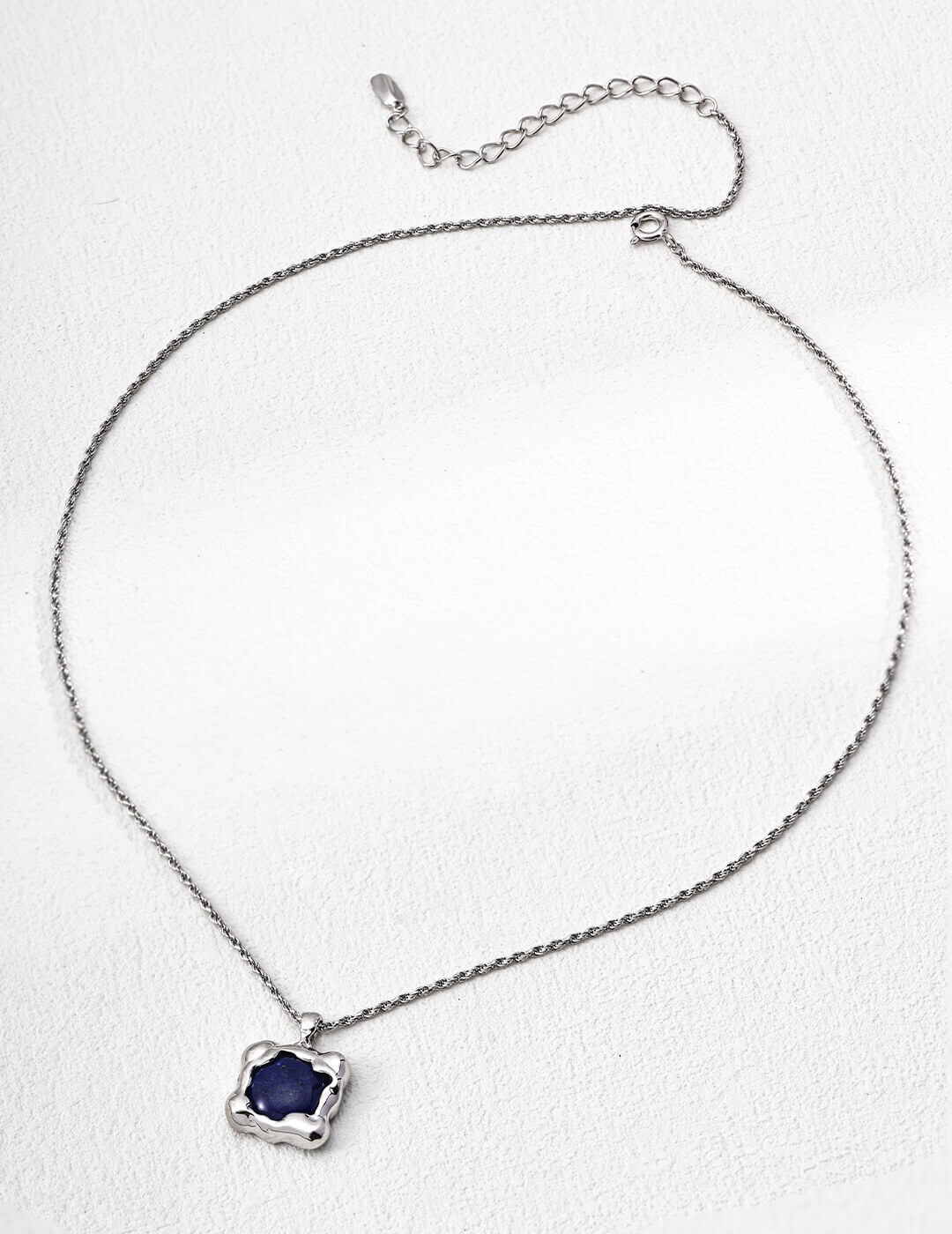 Lapis lazuli pendant necklace with classic silver frame.