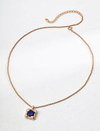 Lapis lazuli pendant necklace with vintage gold plated frame.