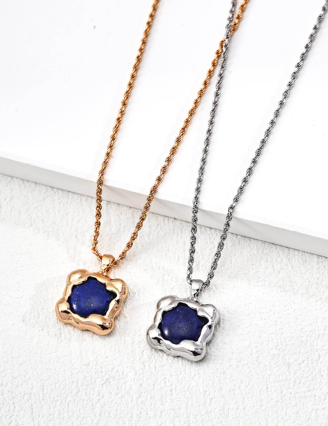 Close-up of the lapis lazuli pendant showing the deep blue stone and silver setting.