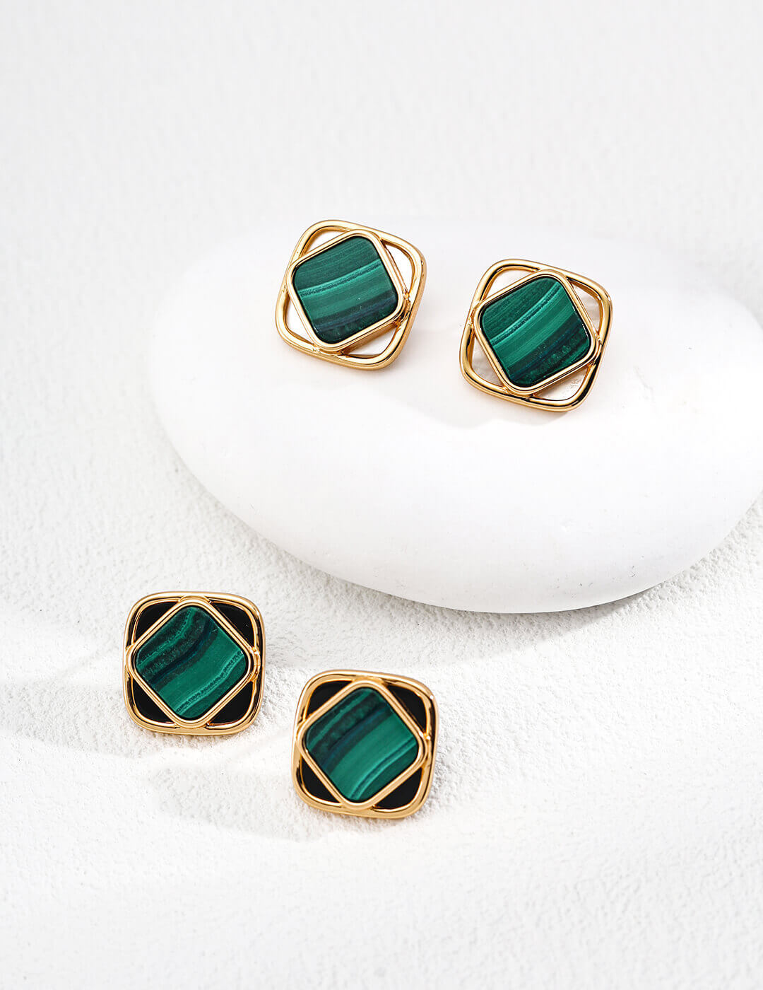 Minimalist earrings featuring natural green malachite, pure white shell, and black onyx, inspired by the moon in a starry sky.