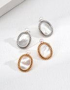 Minimalist natural pearl and shell earrings in S925 sterling silver with a vintage beaded border, inspired by Greek sculpture.