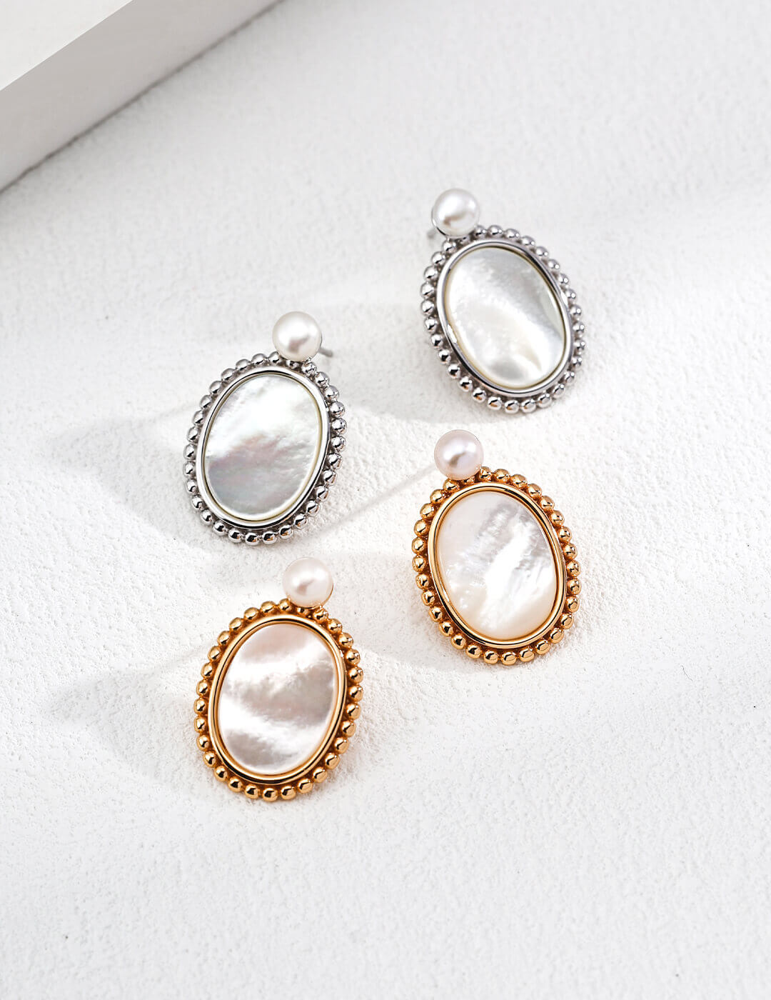 Minimalist natural pearl and shell earrings in S925 sterling silver with a vintage beaded border, inspired by Greek sculpture.