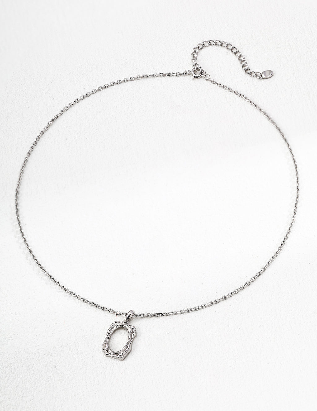 The textured pendant necklace with a classic silver finish.