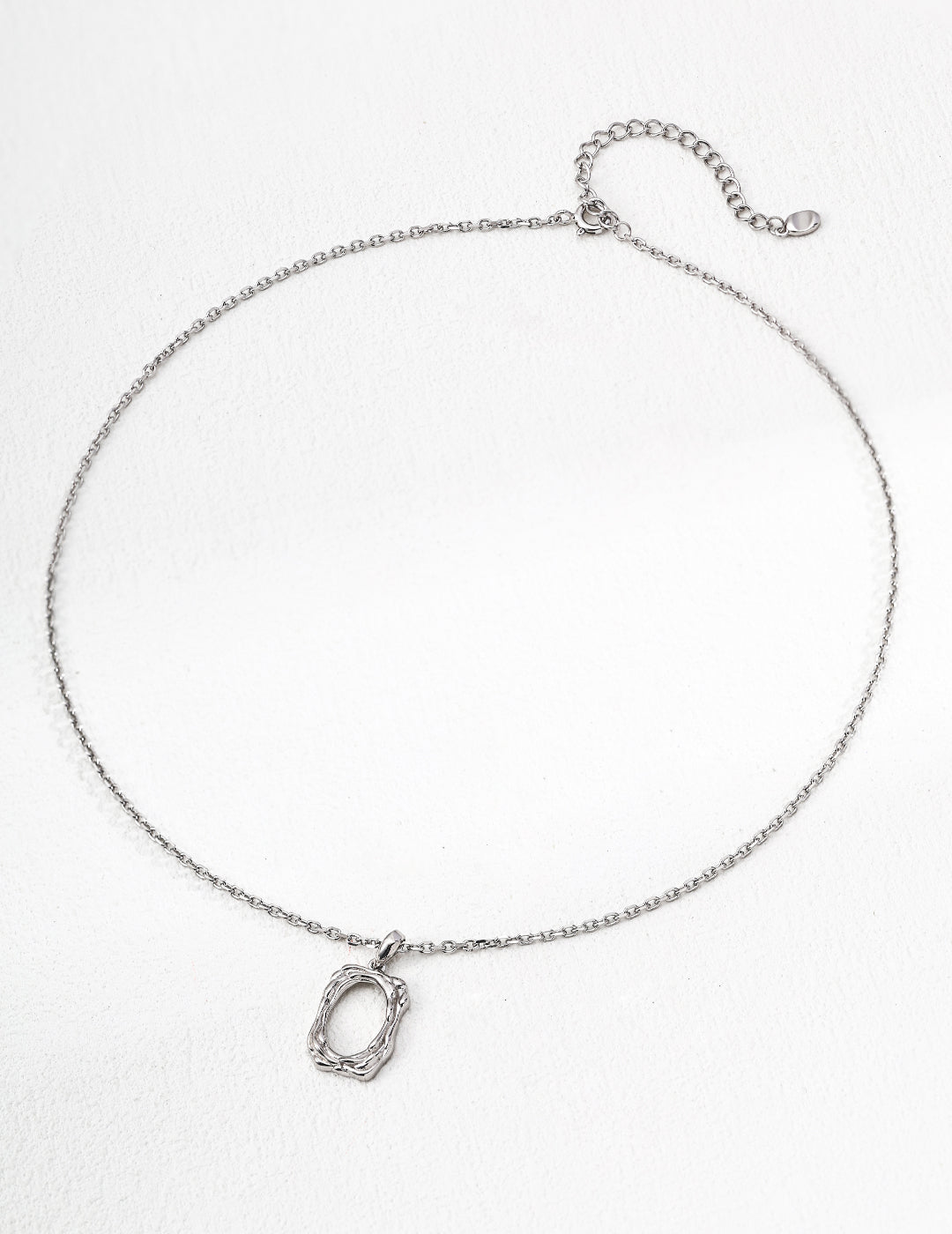 The textured pendant necklace with a classic silver finish.