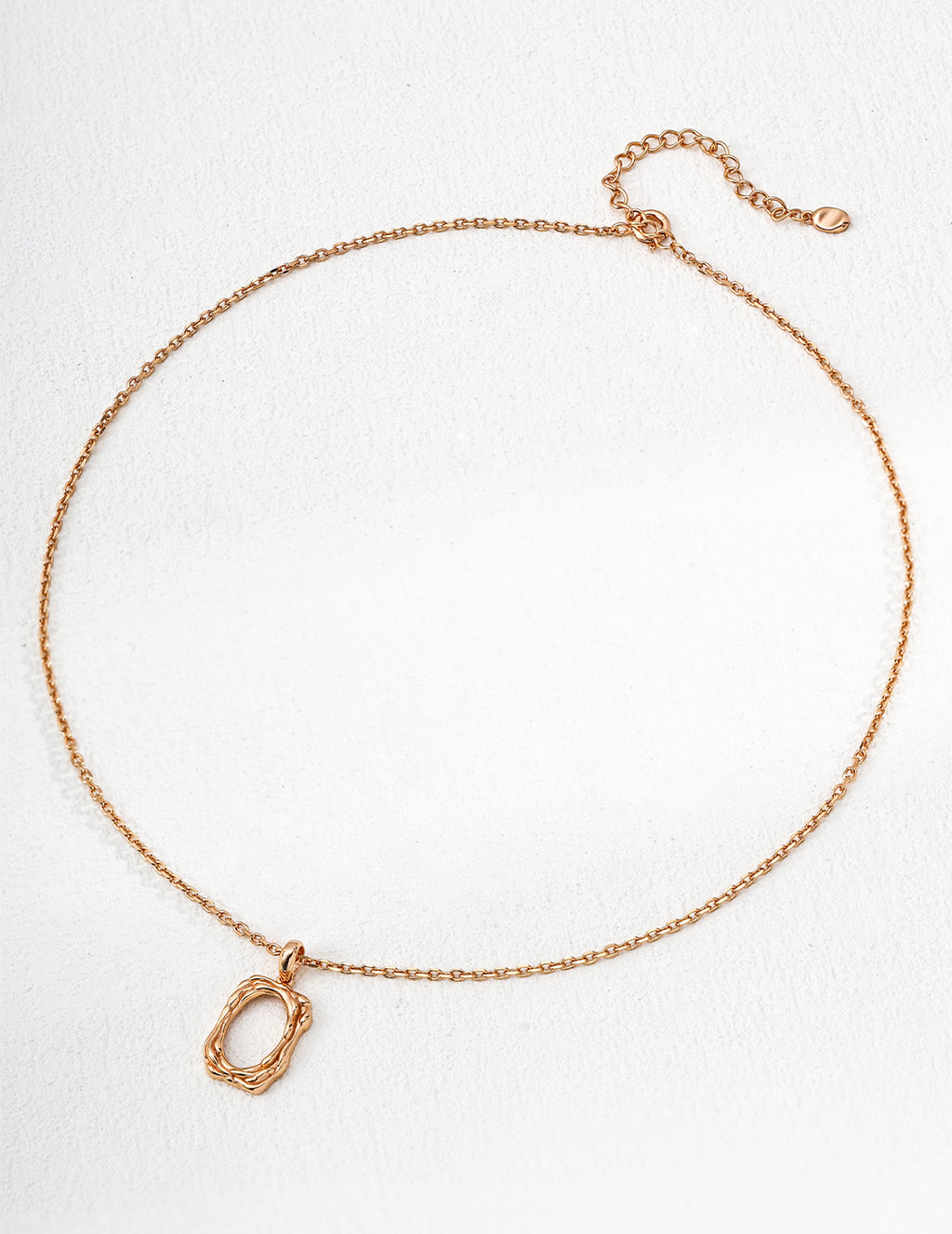 The textured pendant necklace with a warm vintage gold finish.