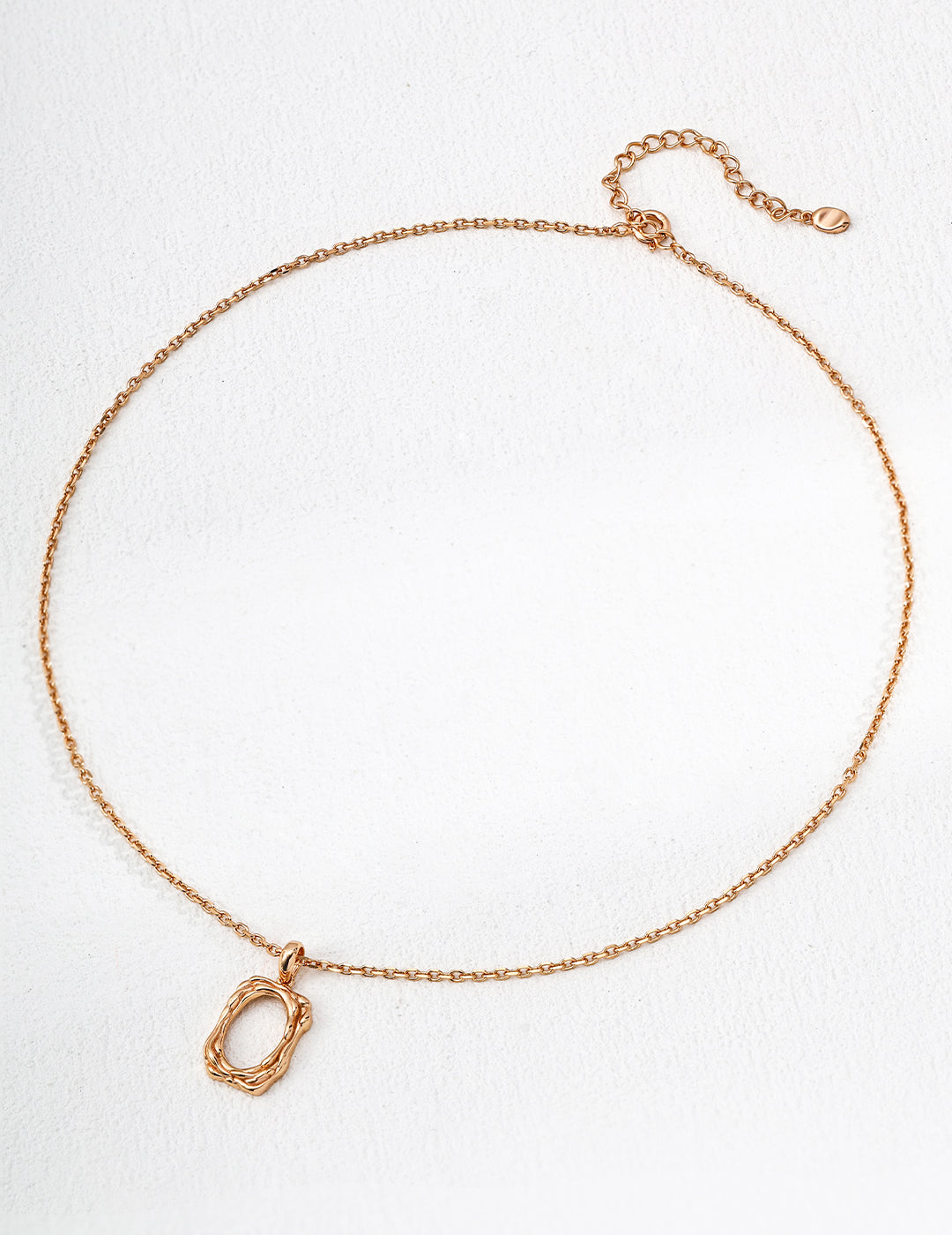 The textured pendant necklace with a warm vintage gold finish.